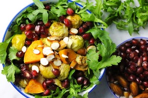 Roasted Brussels sprouts sweet potato salad with crunchy almonds and pomegranates