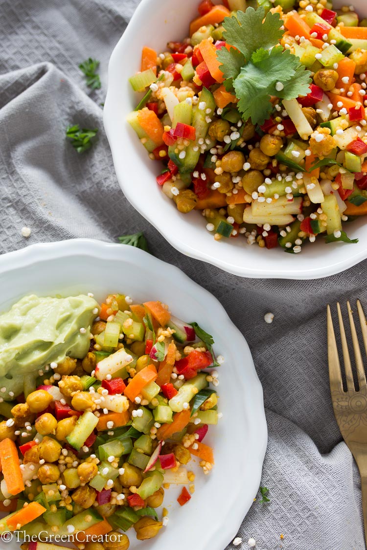 Mixed raw salad with crispy curried chickpeas and creamy avocado dressing