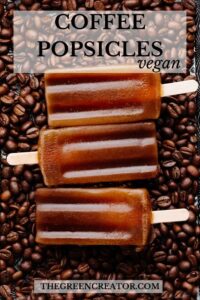 Close up of three brown coffee popsicles on a backdrop of coffee beans with Pinterest text on it