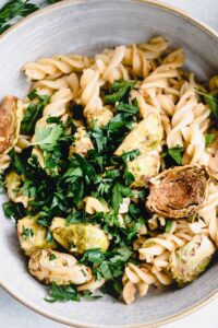 Brussels sprout pasta closeup with chopped parsley on top