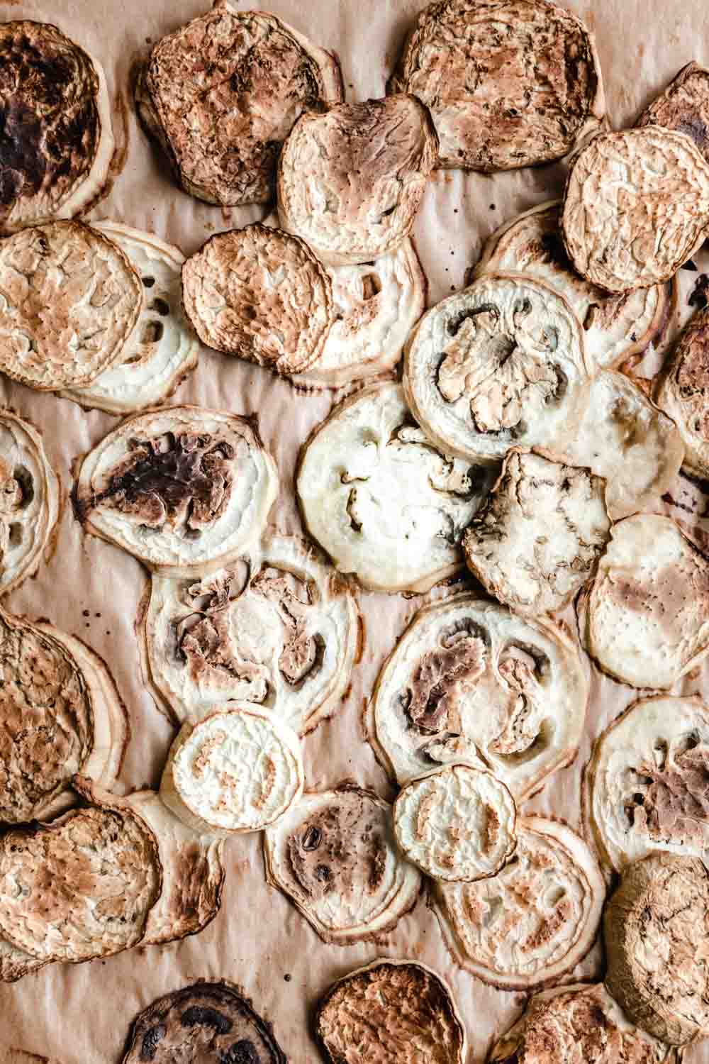 close up roasted eggplant chunks on brown parchment paper
