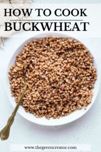 A large bowl on a light grey backdrop with cooked roasted buckwheat in it and a golden fork and the text ''how to cook buckwheat'' in bold on top of the bowl.