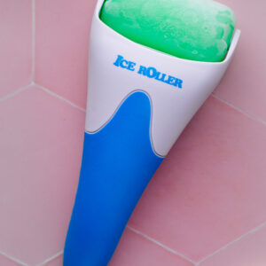 ice face roller with frozen roller on a pink tile backdrop